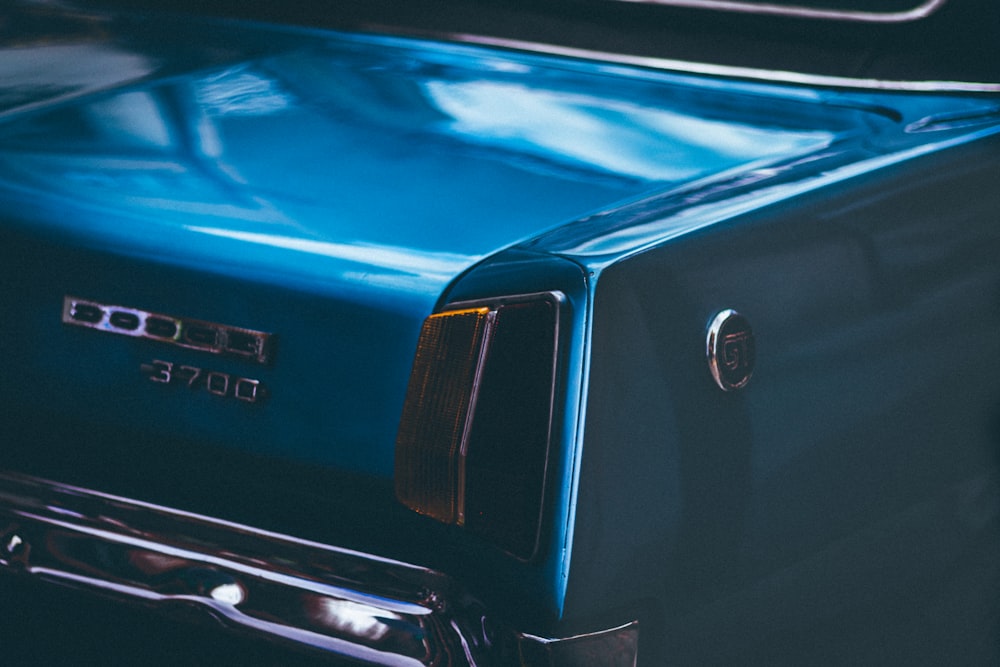 close up photography of blue car