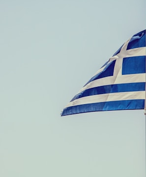 blue and white striped flag on pole