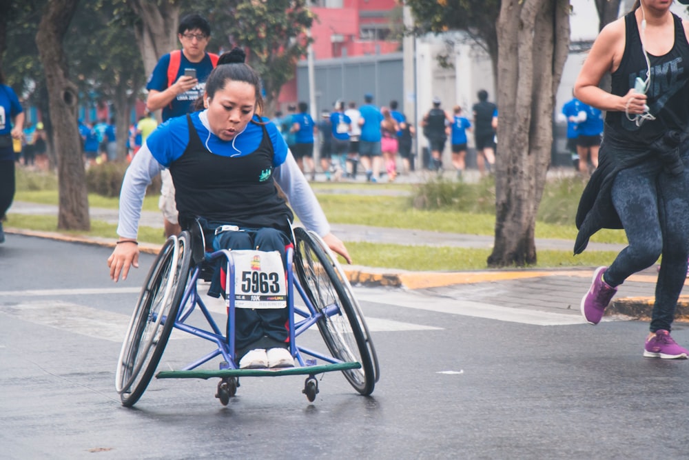 woman sitting on wheelchair during fun run