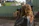 woman holding black DSLR camera during daytime