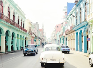 Historic Latin American city street bustling with colorful buildings and local life.
