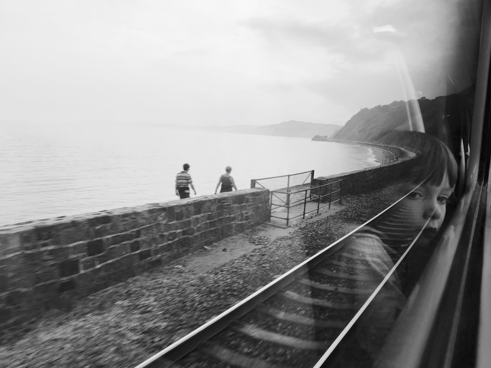 boy looking at window of train