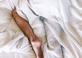 woman covered with white blanket