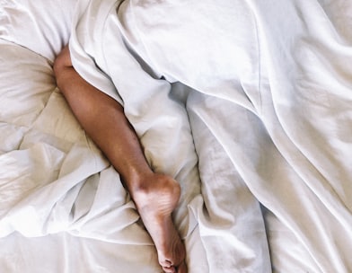 woman covered with white blanket