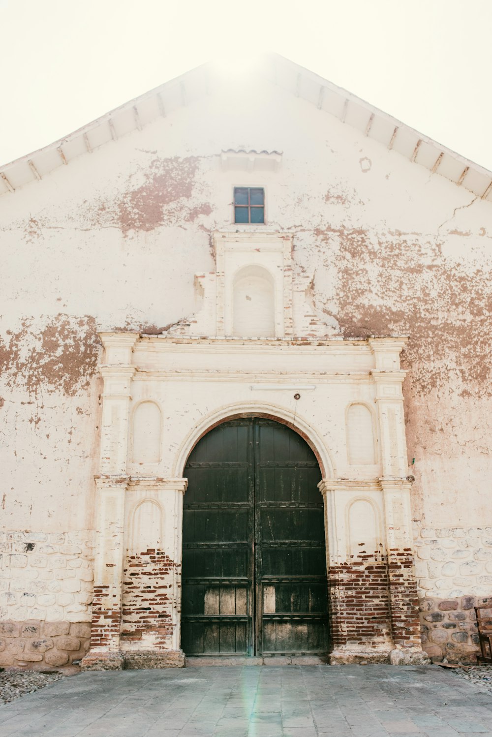 a very old building with a big door