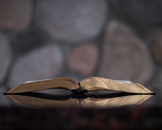 open book on glass table