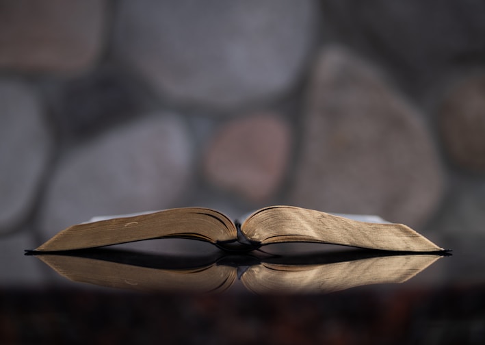 open book on glass table