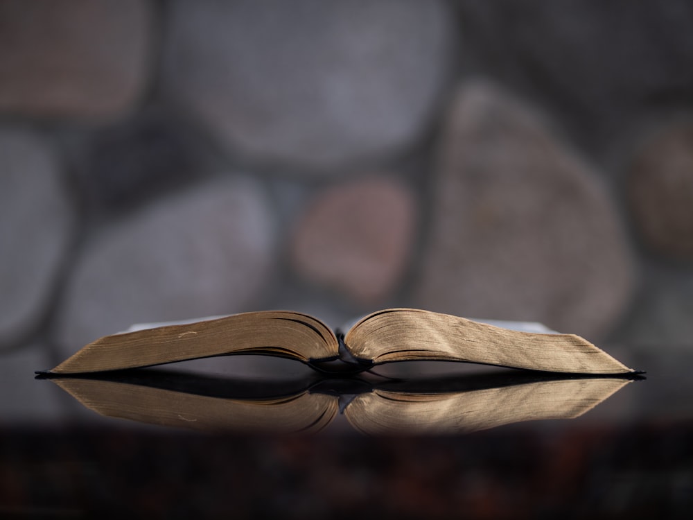 open book on glass table