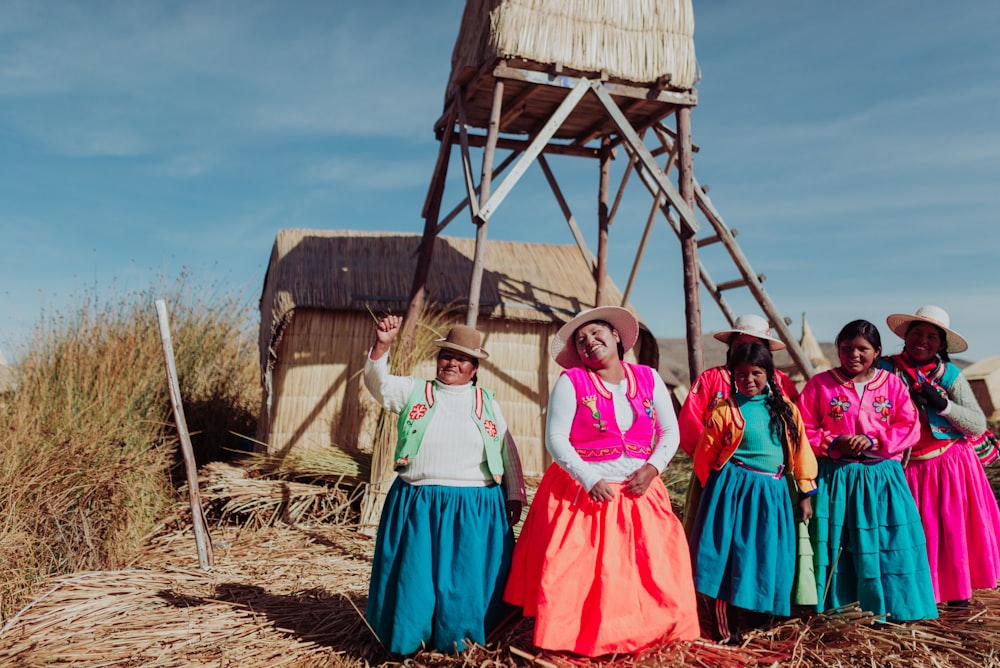 several women standing near tower