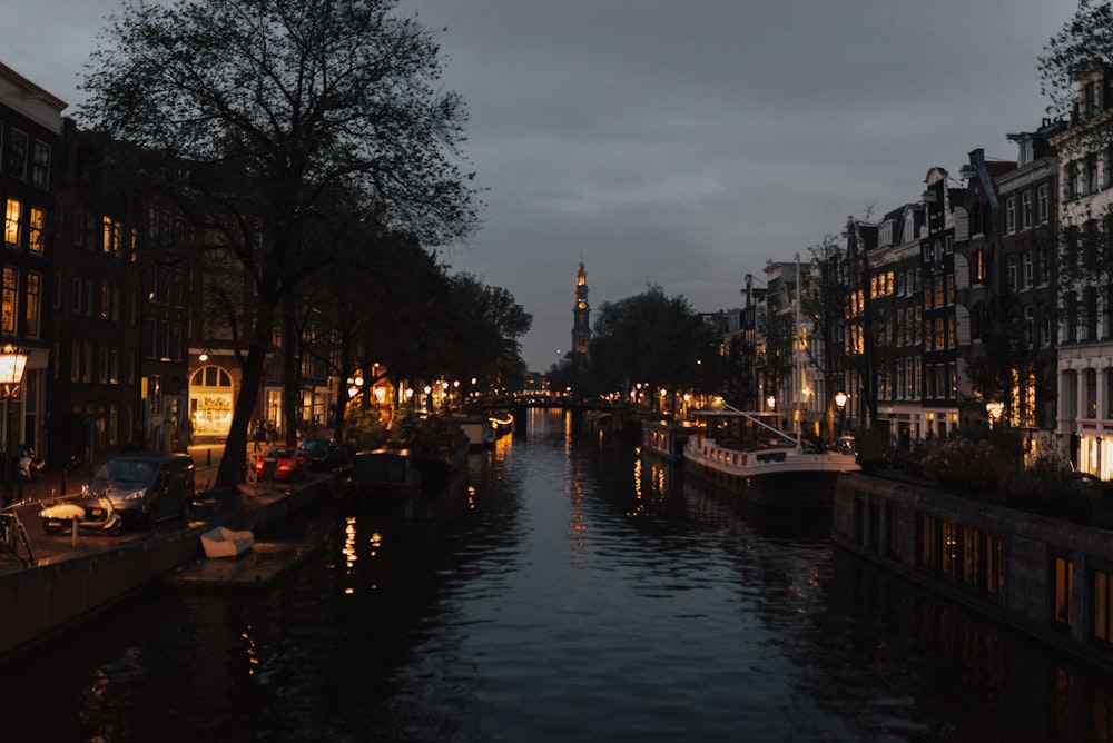 boat docked on body of water beside building