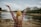 woman raising arms
