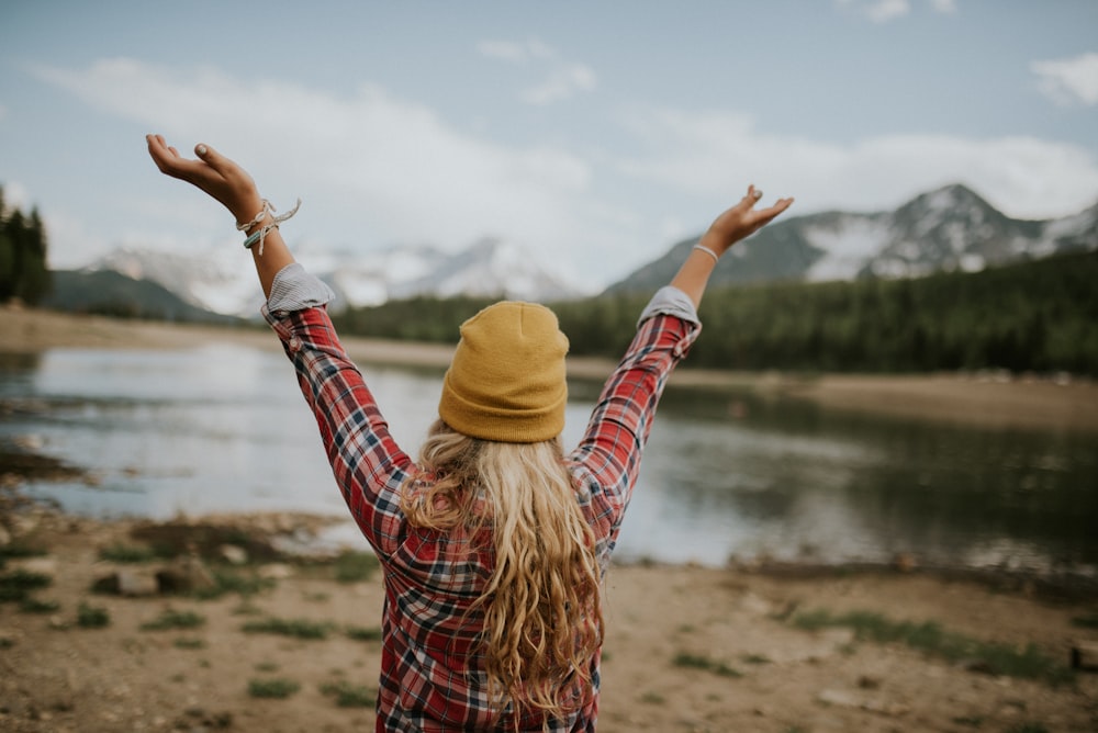 woman raising arms