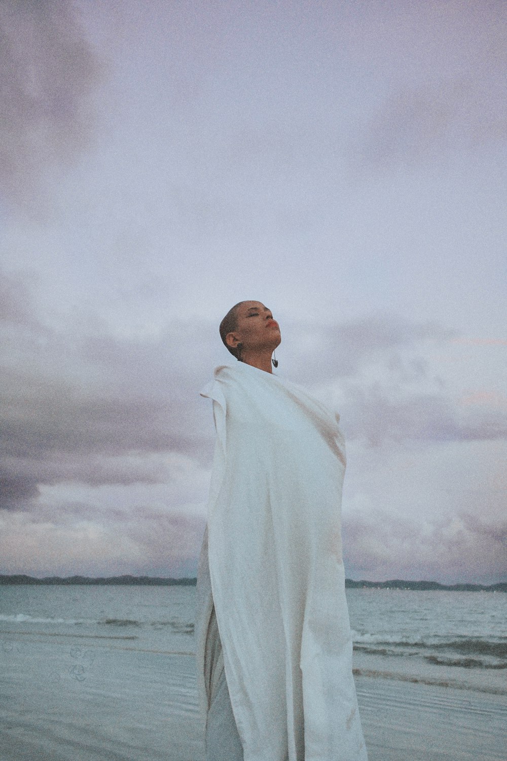 woman wrapped by white textile