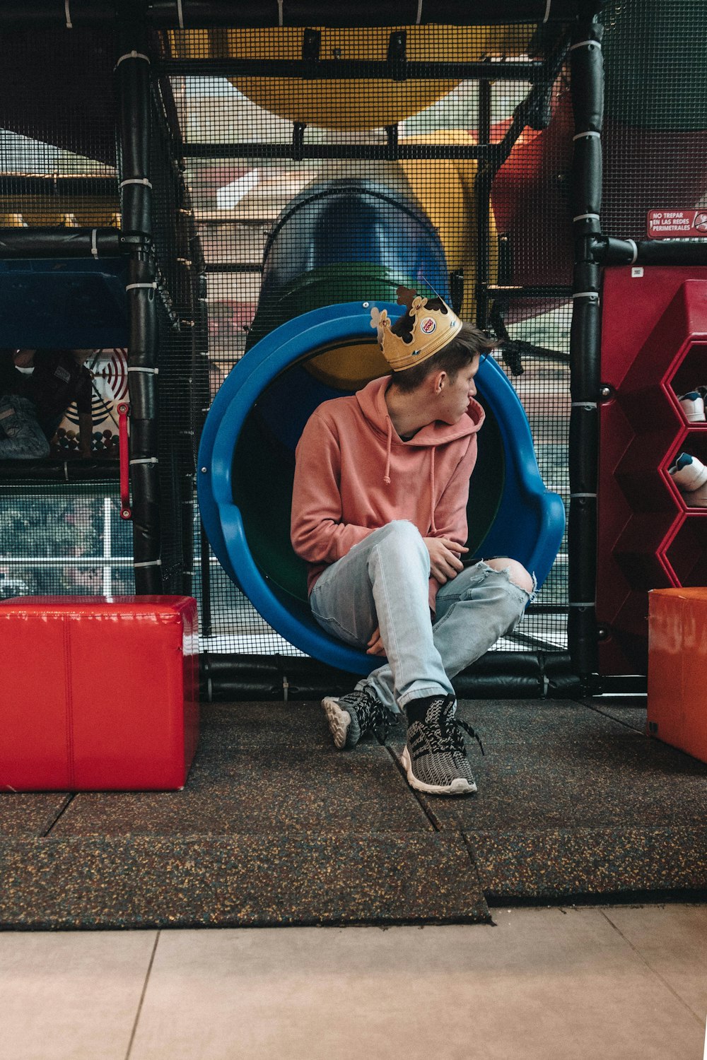 man sitting while wearing crown