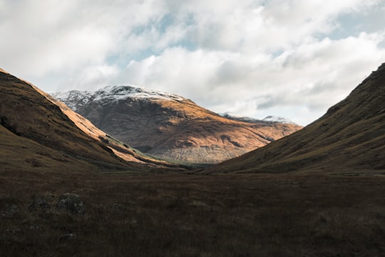 brown rocky mountain during daytime in Glen Coe United Kingdom