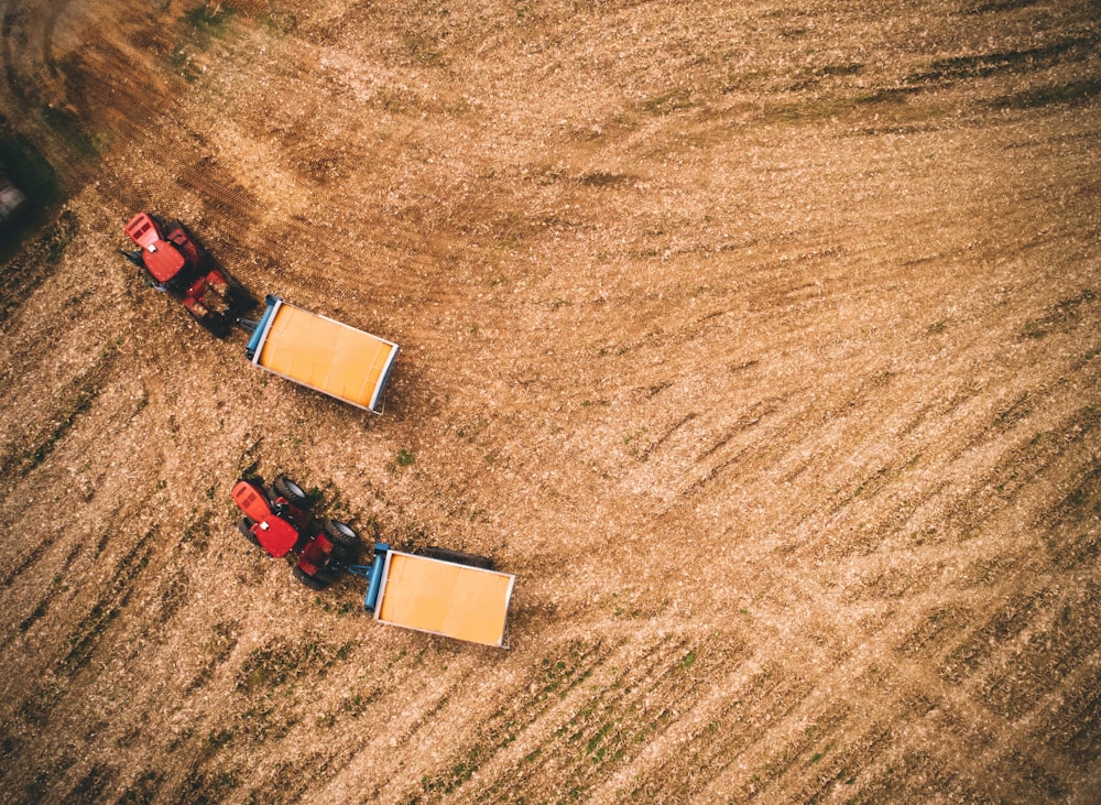 red tractors on field