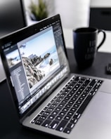 turned-on MacBook Pro on desk