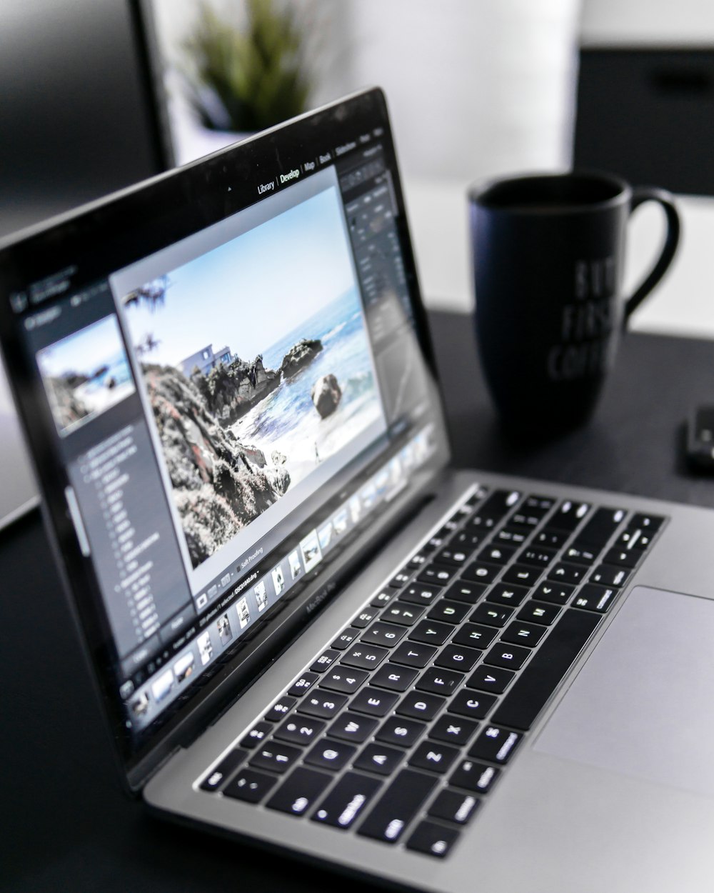 turned-on MacBook Pro on desk