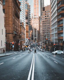 Sydney Inner City people crossing the street surrounded with high-rise buildings