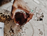 person holding highball glass