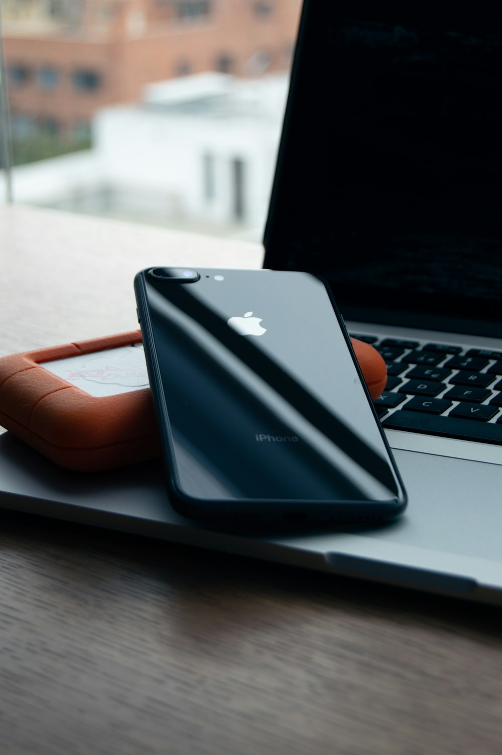 space gray iPhone 8 Plus on brown case