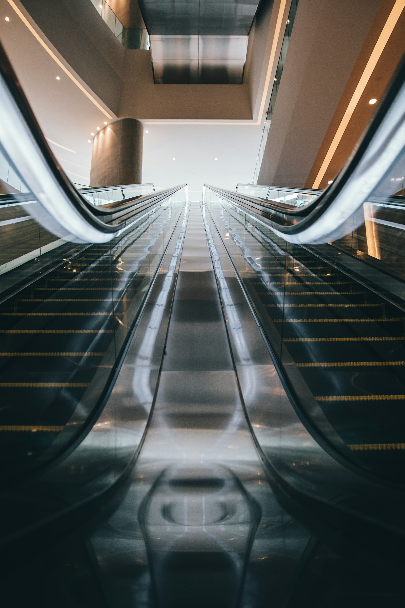 Canon EOS 70D + Sigma 17-70mm F2.8-4 DC Macro OS HSM | C sample photo. Two black escalators inside photography