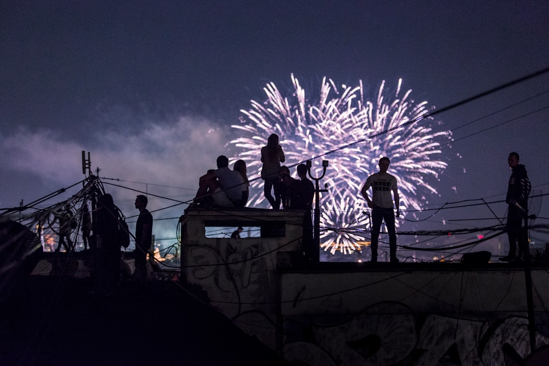 person watching fireworks display