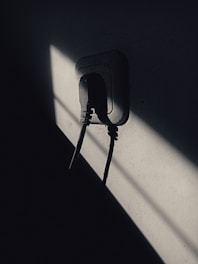 Junior electrician installing new sockets in a bright Essex kitchen.