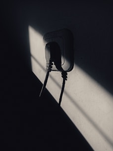 Junior electrician installing new sockets in a bright Essex kitchen.