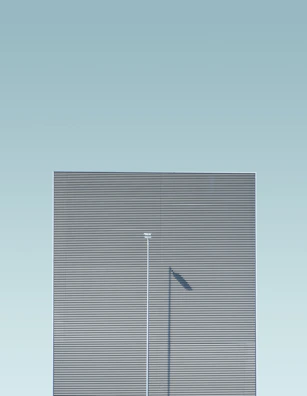 A minimalist urban scene with clean lines and soft tones.