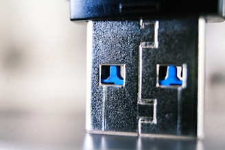 Close-up of high-quality electronic connectors arranged on a sleek dark gray surface with blue accents.