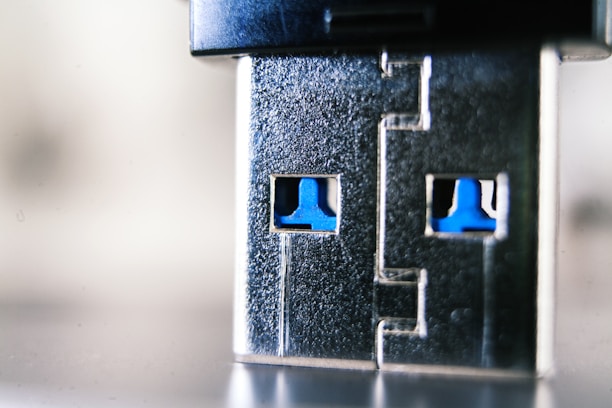 Close-up of high-quality electronic connectors arranged on a sleek dark gray surface with blue accents.