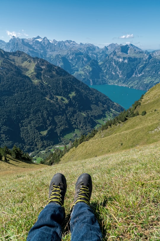 person sitting on grass in Muotathal Switzerland
