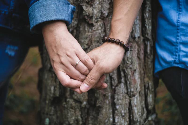 Couple holding hands