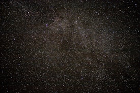 A vast expanse of the night sky filled with countless stars. The image captures the richness and depth of the universe, with numerous small and bright specks scattered across a dark background.