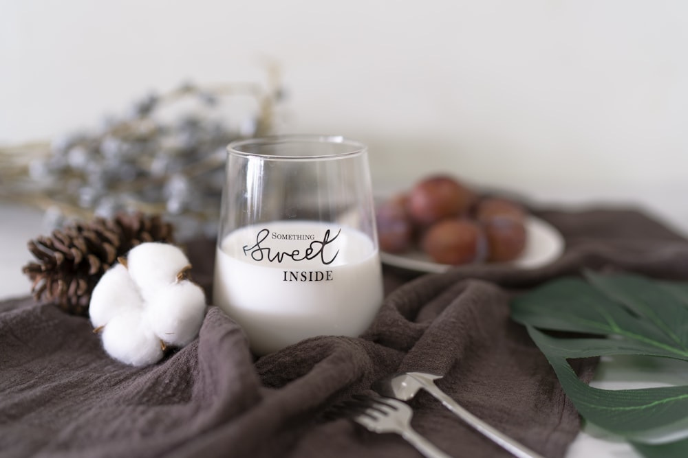 white liquid in glass cup