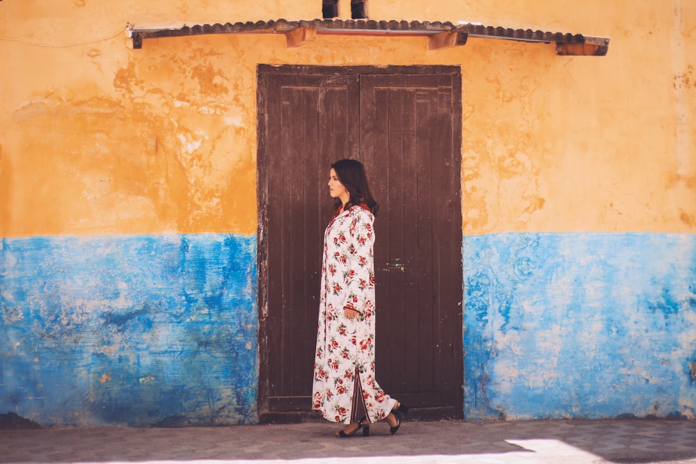 woman standing near wooden door