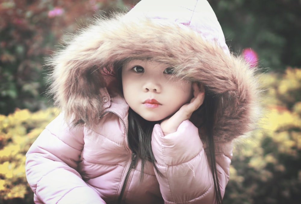 baby beside flowers