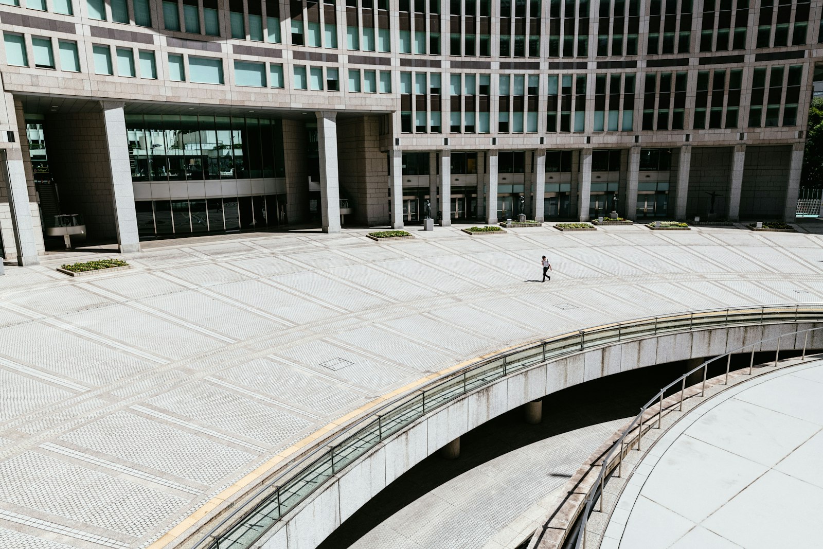 Sigma 14-24mm F2.8 DG HSM Art sample photo. Person walking in concrete photography