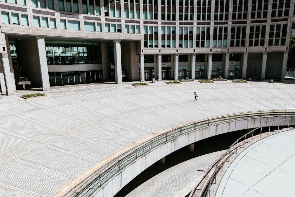 person walking in concrete building