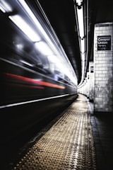 time lapse photography of train in tunnel
