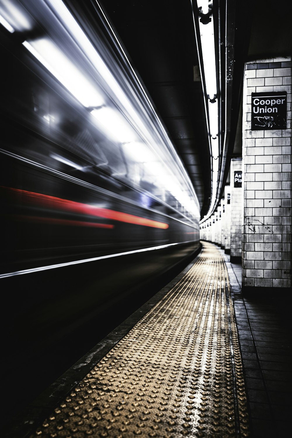 time lapse photography of train in tunnel