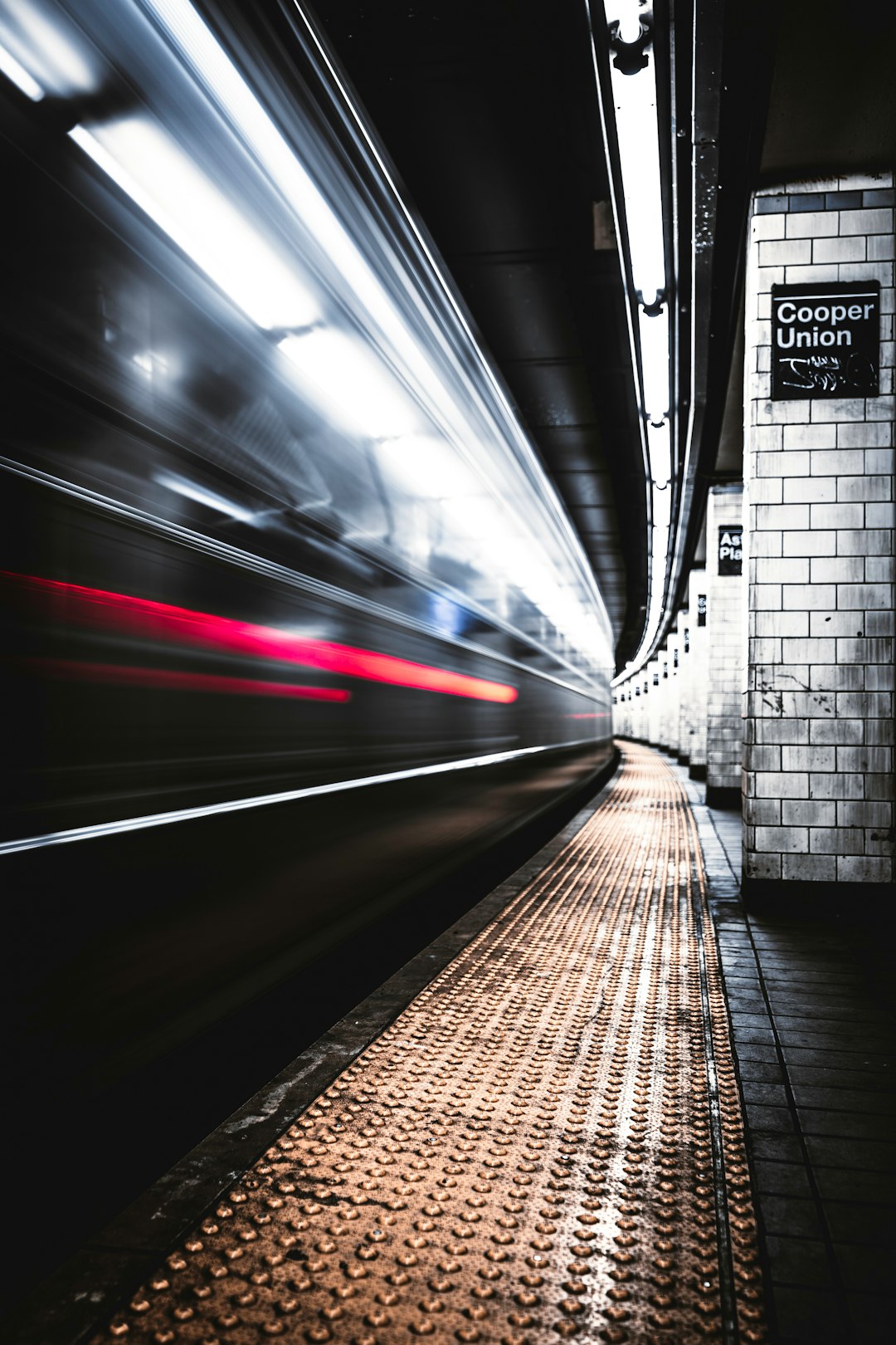 time lapse photography of train in tunnel