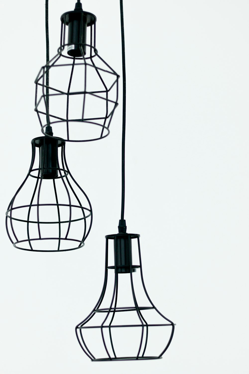 three black pendant lamps