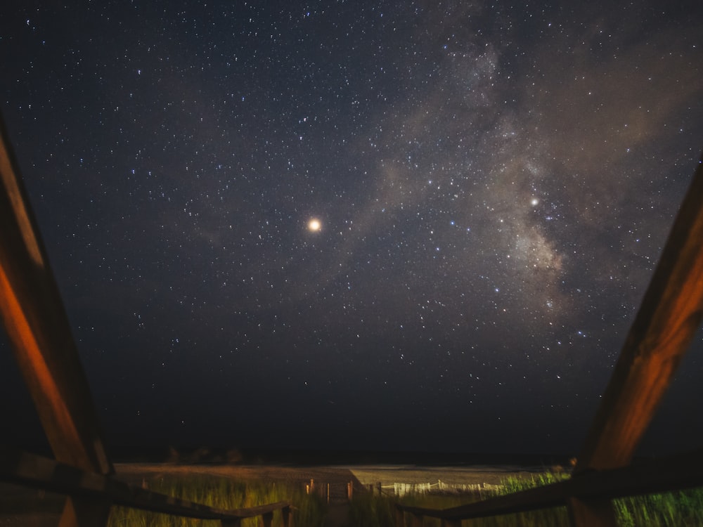 a view of the night sky from a porch