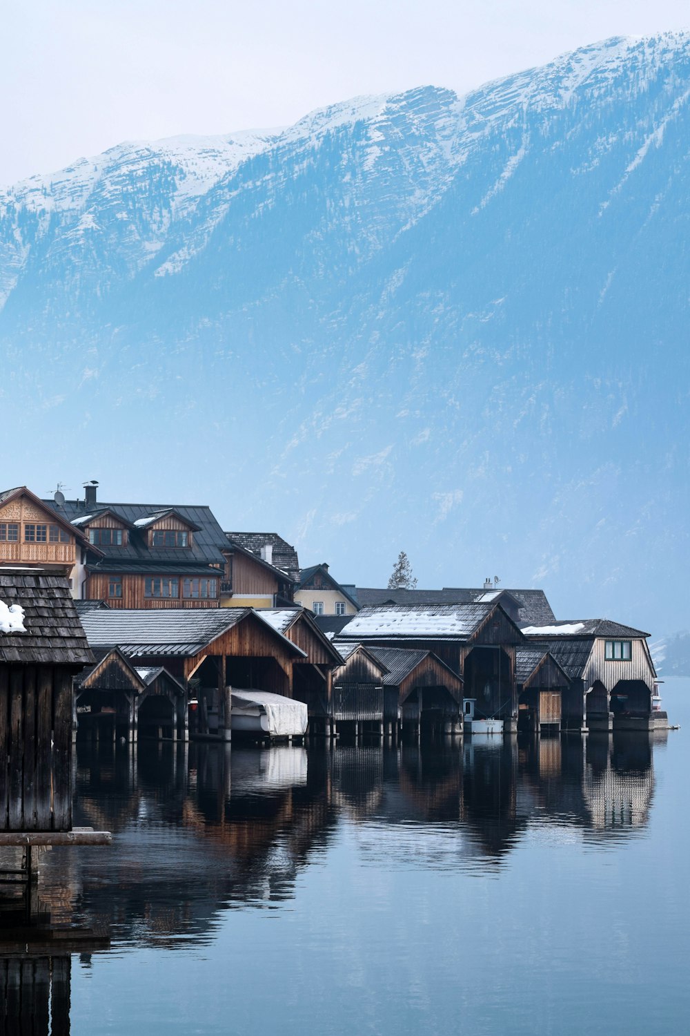 brown and black wooden house near mountain