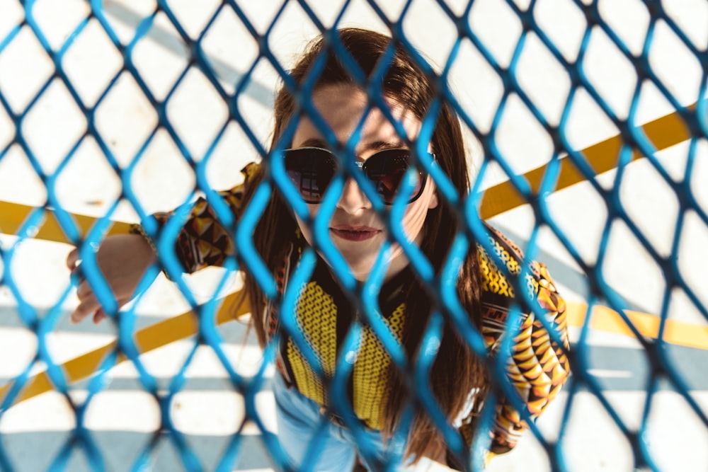 woman standing near blue grille