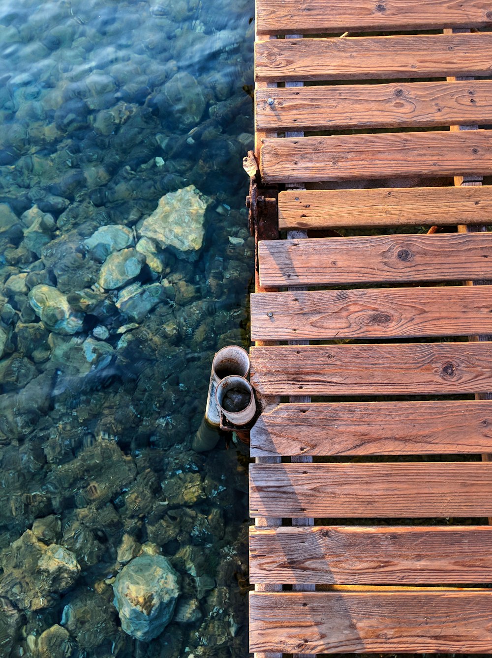 a pair of shoes that are sitting on a dock