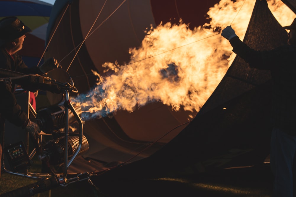 a man standing next to a hot air balloon