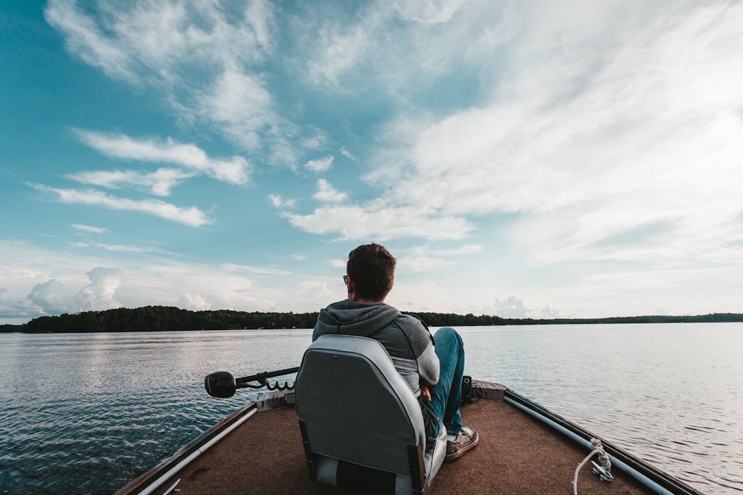 man riding motorboat